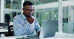Thinking, black man and laptop in office for finance report, company audit or online research. Accountant, typing and glasses with tech for performance review, management or bookkeeping at firm