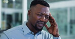 Stress, pressure or black man in office with headache, frustration or update mistake in task management. Tired, pain or employee in agency with migraine, poor report review or burnout in deadline.