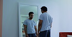 Mirror, mental health and man with disgust in home, disappointment or negative thoughts for shame. Reflection, body dysmorphia or frustrated person with poor self image, tired or upset for appearance