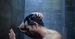 Man, dark shower and sad in bathroom at home, stress and mental health with ptsd for bad memory. Person with depression, blur and anxiety with water drops, crying or frustrated with trauma at house