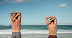 Back, ocean and men with exercise, stretching and wellness with waves, morning routine and workout. Beach, training and healthy people with balance, coastline and muscular with warm up and fitness