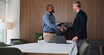 Mature businessman, shaking hands and tablet at office for b2b agreement, laptop and talk at insurance company. People, happy and handshake with deal, support and success at risk management agency