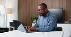 Business, black man and typing in office with laptop for data analysis, financial planning or audit. Mature person, review or evaluation in workplace with computer, budget report or finance document.