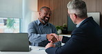 Businessmen, meeting and handshake with laptop for corporate proposal or negotiation. Business people, employees or colleagues shaking hands with smile for partnership, b2b or onboarding in workplace