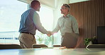 Businessmen, meeting and agreement with handshake for corporate proposal, deal or negotiation. Business people, employees or colleagues shaking hands for partnership, b2b or onboarding in workplace