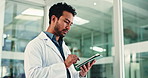 Doctor, man and reading in office with tablet for health insurance info, medical research or report. Healthcare worker, person or scroll with digital tech in clinic for telehealth, website or review.