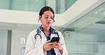 Doctor, woman and scroll in hospital with phone for schedule check, text message and medical update. Healthcare worker, person and walking in clinic with tech for patient email, research and agenda.