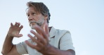 Mature man, tai chi and meditation with motion for mindfulness, balance or energy flow in nature. Blue sky, male person or martial art with movement for strength, spiritual wellness or channeling Qi