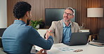 Corporate, men and meeting with handshake in office for partnership, agreement and finance deal. People, team and shaking hands with laptop for financial achievement, negotiation and funding proposal