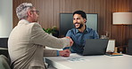 Business, people and smile with handshake in meeting for partnership, agreement and finance deal. Men, team and shaking hands with laptop for financial achievement, negotiation and funding proposal