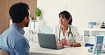 Doctor, patient and talking in office with laptop for checkup, test results feedback and insurance. Healthcare worker, people and discussion with computer, medical aid recommendation or consultation.