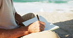 Beach, calm and man writing in journal for emotions, mental clarity or self care on holiday. Pen, hands and male person with diary for reflection by ocean for relax, peace or mindfulness on vacation.