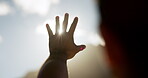 Sunshine, hands and glare with person outdoor for vision protection, light flare and travel holiday. Summer vacation, uv ray and blue sky with man or tourist in nature for shadow, safety and shield