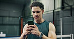 Phone, fitness and man on padel court with networking, communication or texting on mobile app. Technology, notification and athlete with cellphone for chatting with contact at indoor racket sports.