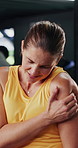 Fitness, injury and woman in gym with shoulder pain, accident or muscle sprain with workout. Arthritis, osteoporosis and female athlete with joint inflammation, hurt or ache in sports center.