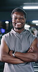 Arms crossed, face and laughing with man in gym for commitment to training, vitality or workout. Confident, exercise and fitness with funny person in health club for dedication or physical challenge