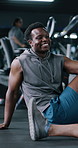 Happy, man and stretching at gym for fitness, coaching advice and prepare for exercise. Male person, talking and warm up with personal trainer on floor, training feedback and tips for workout session