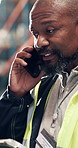 Black man, tablet and phone call at warehouse for logistics, feedback or report for inventory management. Mature person, tech and talk with app, storage and supply chain job at distribution plant