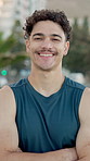 Fitness, happy and face of man in city with crossed arms for exercise, training and workout outdoor. Sports, runner and portrait of person smile for challenge, health and active hobby for wellness