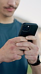 Hands, fitness and man with cellphone, internet and digital app to track progress. Closeup, mobile user and healthy person with smartphone, network and online reading for workout routine and email