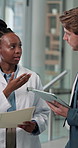 Healthcare, meeting or tablet with doctor and administrator in hospital together for review. Administration, advice and medical with people in clinic for brainstorming, feedback or management