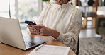 Phone, remote work and hands of woman in home office on break, check email or financial blog post. Freelance accountant, mobile and person in house for text, typing and budget review with laptop