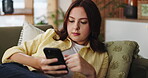 Break, phone and social media with woman on sofa in living room of home for post or update. App, relax and scrolling with person typing on mobile in apartment for communication, me time or reading