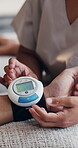 Nurse, patient and hands in medical clinic with blood pressure machine, wellness and healthcare checkup. Doctor, people and digital tech with equipment, test results and diagnosis for hypertension.