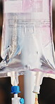 Closeup, IV drip or bag with medical treatment for chronic condition, illness or cure in hospital. Closeup, fluid or liquid medication with vitamin nutrition for immune booster or clinic supplement