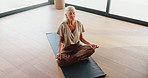Above, meditation and yoga with mature woman in studio for balance, mental health or wellness. Exercise, mudra and zen with yogi person on floor for awareness, inner peace or mindfulness routine