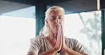 Yoga, senior woman and prayer hands in meditation class, mantra or peace for holistic wellness. Yogi chant, elderly people and group with spiritual exercise, zen or fitness in retirement in studio