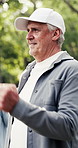 Senior man, walking and physiotherapy with class in park for cardio exercise, mobility or recovery. Elderly, male person or movement with group for outdoor fitness, health or wellness in retirement