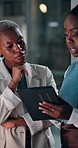 Creative, meeting and women on tablet at night for article review, deadline and news report. Media agency, publishing and black people on digital tech for story feedback, copywriting and submission