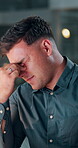 Night, eye strain or man in office with tech, headache or tired in task management. Screen fatigue, pressure or employee in agency with migraine, deadline issue or vision discomfort in evening shift.