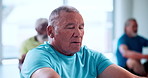 Senior, man and breathing with meditation in class for yoga, spiritual wellness or zen. Male person, elderly group or session with inner peace for mindfulness, chakra or mudra together in health club