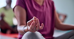Closeup, person and hands with meditation in class for yoga, spiritual wellness or zen. People, lotus pose or group session with inner peace for mindfulness, chakra or mudra together in health club