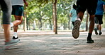 People, legs or running club in park with fitness, sports challenge or endurance training for wellness. Group, feet or shoes outdoor with cardio workout, speed exercise or Paris marathon preparation.