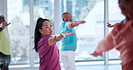 Yoga class, mature people and fitness with stretching, spiritual wellness and arms up in gym. Woman, retirement and group balance in health club with warm up for pilates, mobility and elderly care