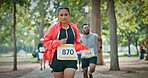 Running, marathon and woman with group in park for race, endurance challenge and fitness goal outdoor. Sports event, athlete and people for runners contest, competition and exercise for workout