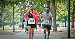 Running, fitness and people in park for marathon, endurance challenge and sports event outdoor. Race, athlete and men and women on trail for runners contest, competition and exercise for workout