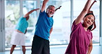Stretching, elderly people and happy in class, flexibility and exercise to prevent muscle stiffness. Gym, old women and workout with senior men, personal trainer and active for fitness and wellness