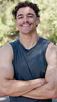Fitness, face of man and happy with arms crossed outdoor for cardio break, exercise and wellness. Runner, person and laughing in nature for morning workout, running pace pride or triathlon confidence