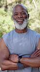 Athlete, face of man and happy with arms crossed outdoor to start running, exercise and fitness. Runner, mature black person and laughing in nature for morning workout, triathlon confidence or health