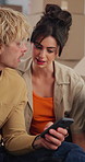 Couple, phone and moving with boxes in new home for online shopping, talk or search for furniture. Happy man, woman and discussion with smartphone, interior design app or relocation with real estate