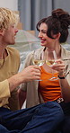 Happy couple, new home and cheers with champagne for celebration or moving in together. Excited man, woman or homeowners with smile, alcohol or toast for relocation, property or fresh start in house