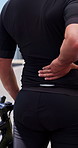Fitness, cycling and person outdoor with back pain, injury or muscle sprain for exercise. Sports, sore and athlete with workout or training with bicycle for joint inflammation, accident or hurt.