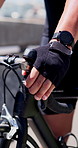 Sports, bicycle and hands of man in city with brake for cycling, exercise and workout on road. Fitness, athlete and person on bike for practice, active hobby and training for challenge outdoor