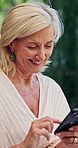 Phone, laughing and scroll with old woman outdoor for social media joke, viral meme and contact. Communication, funny post and happiness with senior person and mobile in nature for chat and typing