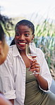 Woman, wine glass and laugh at picnic with friends for conversation, reunion or relax on vacation. People, group and happy for drinks, alcohol or funny story for break, bonding or surprise on holiday