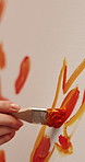 Person, hands or stroke with paint brush on canvas for artwork, drawing or creative design. Closeup, artist or painter with orange color, creativity or tools for art project, artistic skill or talent